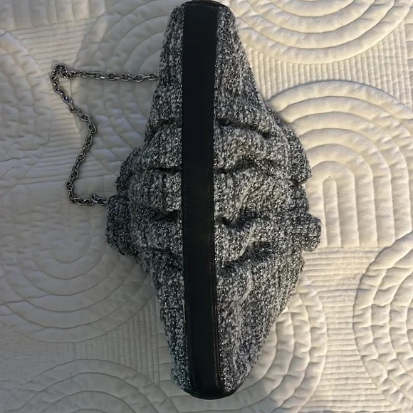 Shades of woven gray, and silver and black leather trim.Removable silver chain